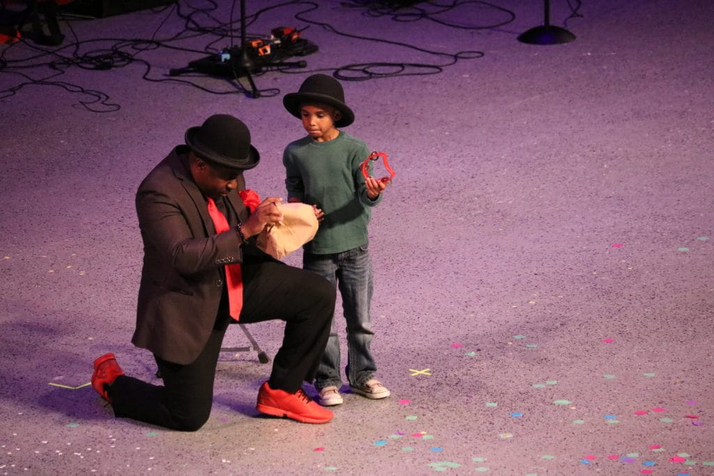 Indianapolis magician performing for kids at a youth event, making children laugh with interactive comedy magic.