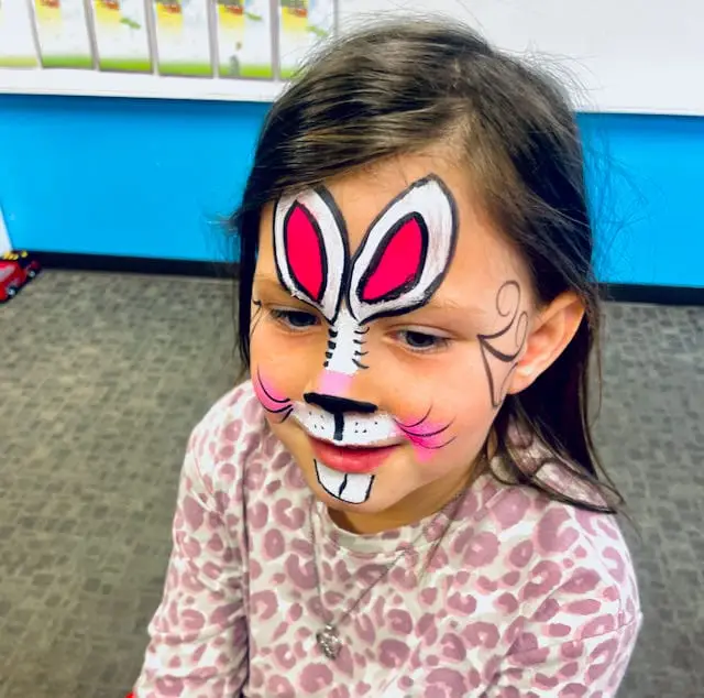 Face painter Tiphanny creating fun designs for children at Brownsburg Baptist Church event.