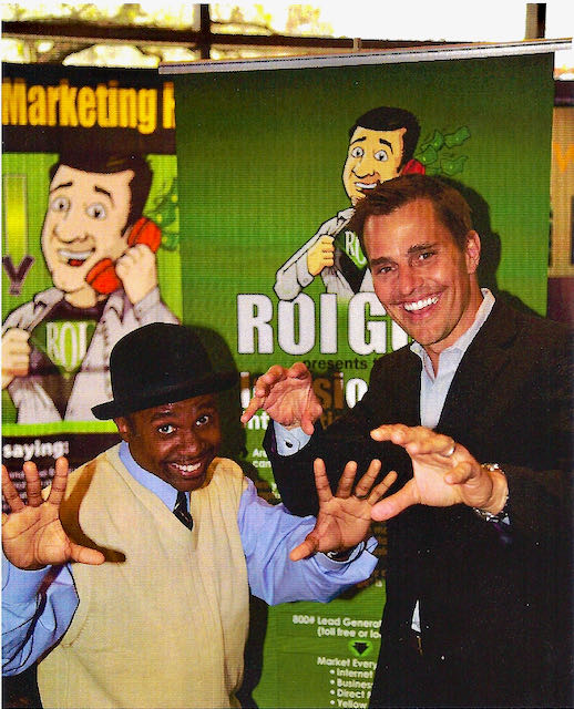 The Magic Comic Jamahl Keyes and Bill Rancic posing after comedy magic performance at JW Marriott Downtown Indianapolis Small Business Conference closing banquet.