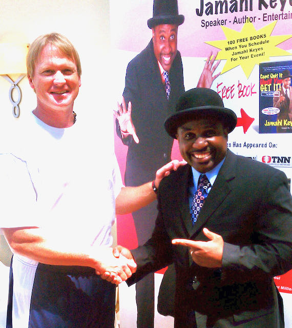 Super Bowl Champion Coach Jon Gruden posing with The Magic Motivator Jamahl Keyes after a motivational magic performance for his football team.