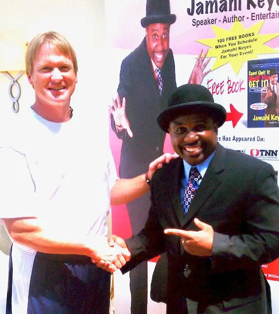 Super Bowl Champion Coach Jon Gruden posing with The Magic Motivator Jamahl Keyes after a motivational magic performance for his football team.