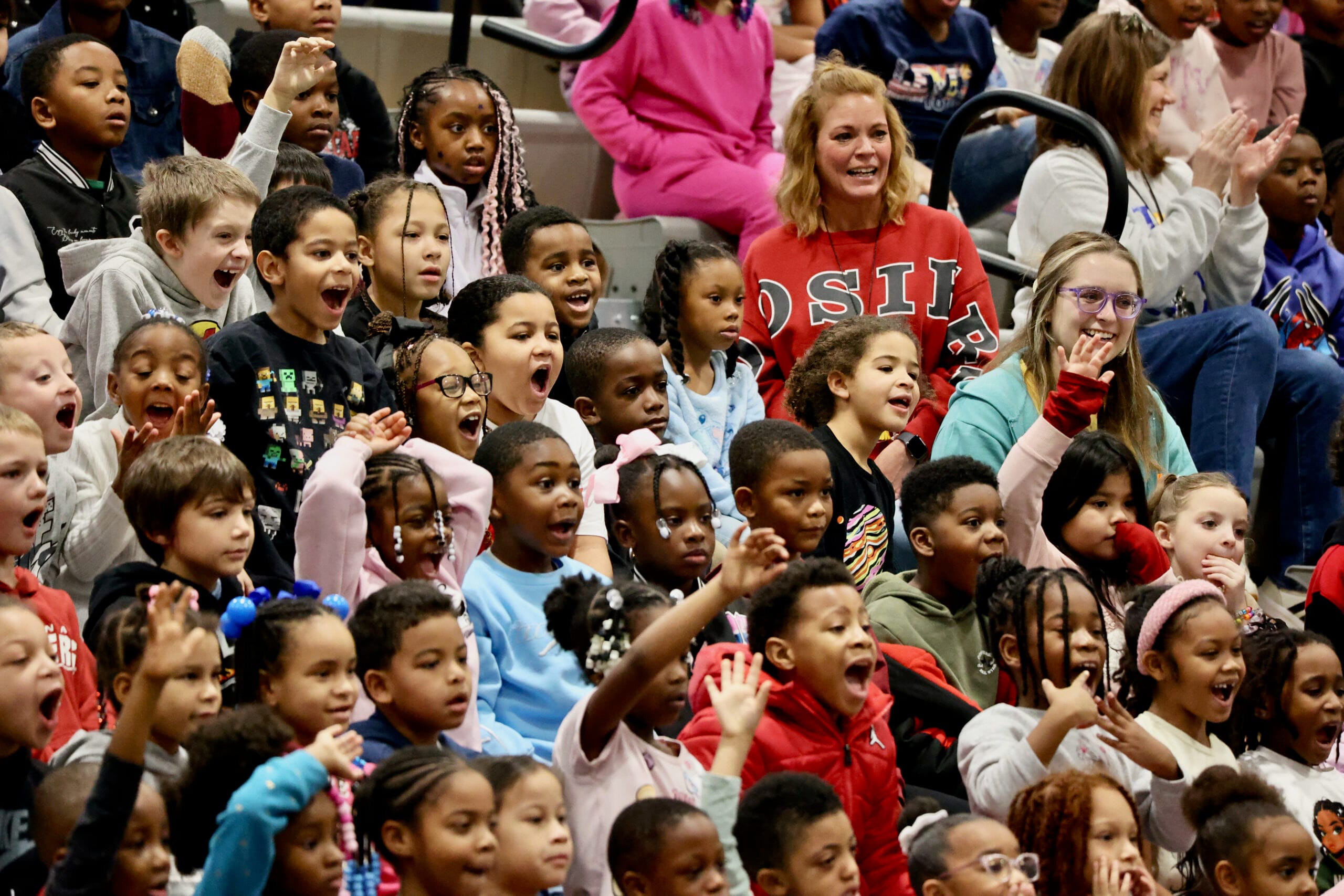 Jamahl Keyes performing a motivational magic routine for students, highlighting social emotional learning and goal-setting during an Indiana school assembly.