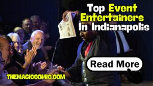 Corporate event entertainer Jamahl Keyes performing live comedy magic on stage for a large corporate audience in Indianapolis.